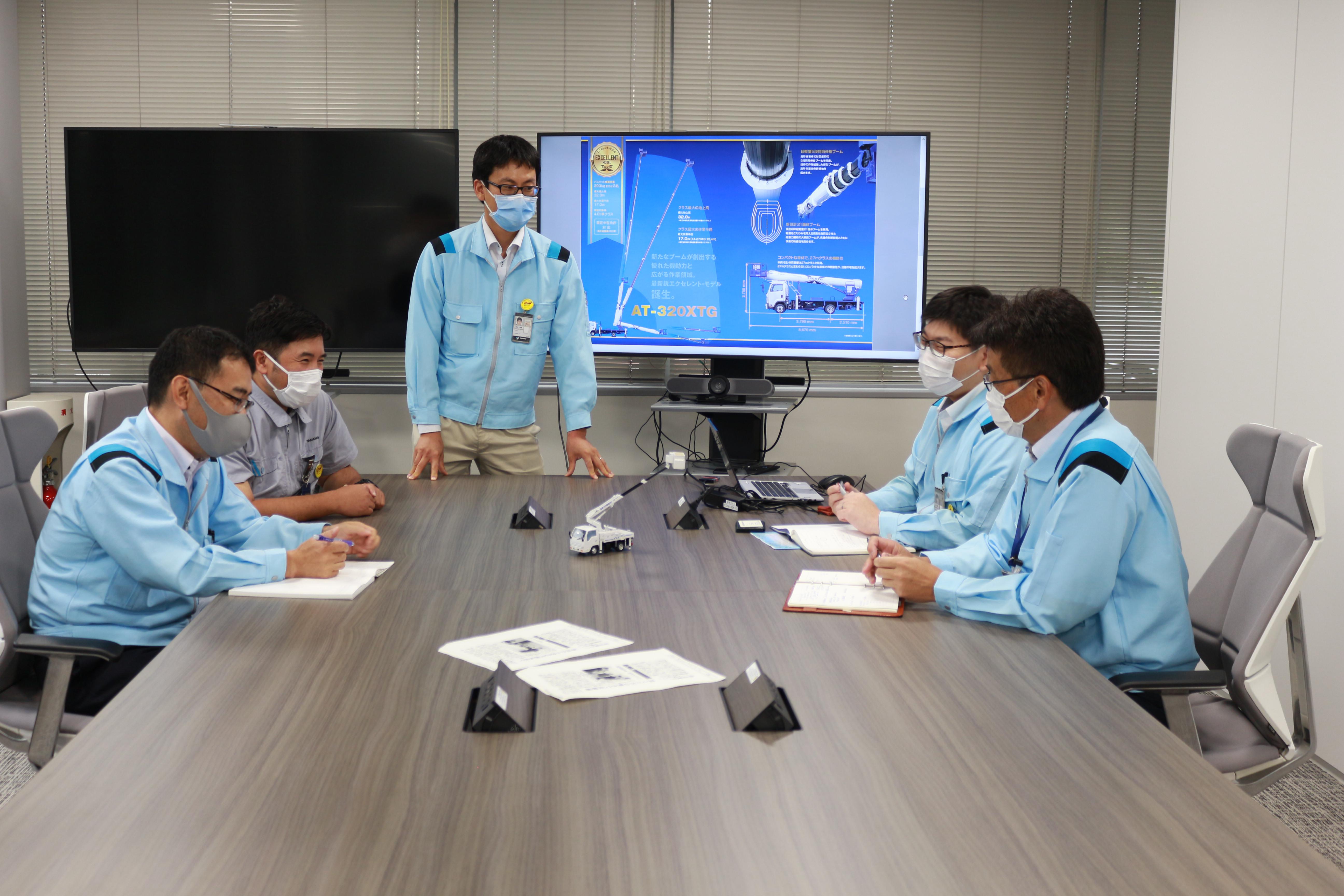 Chief Designer Mr. Yamashita (2nd from the right) and the rest AT-320XTG Design team
